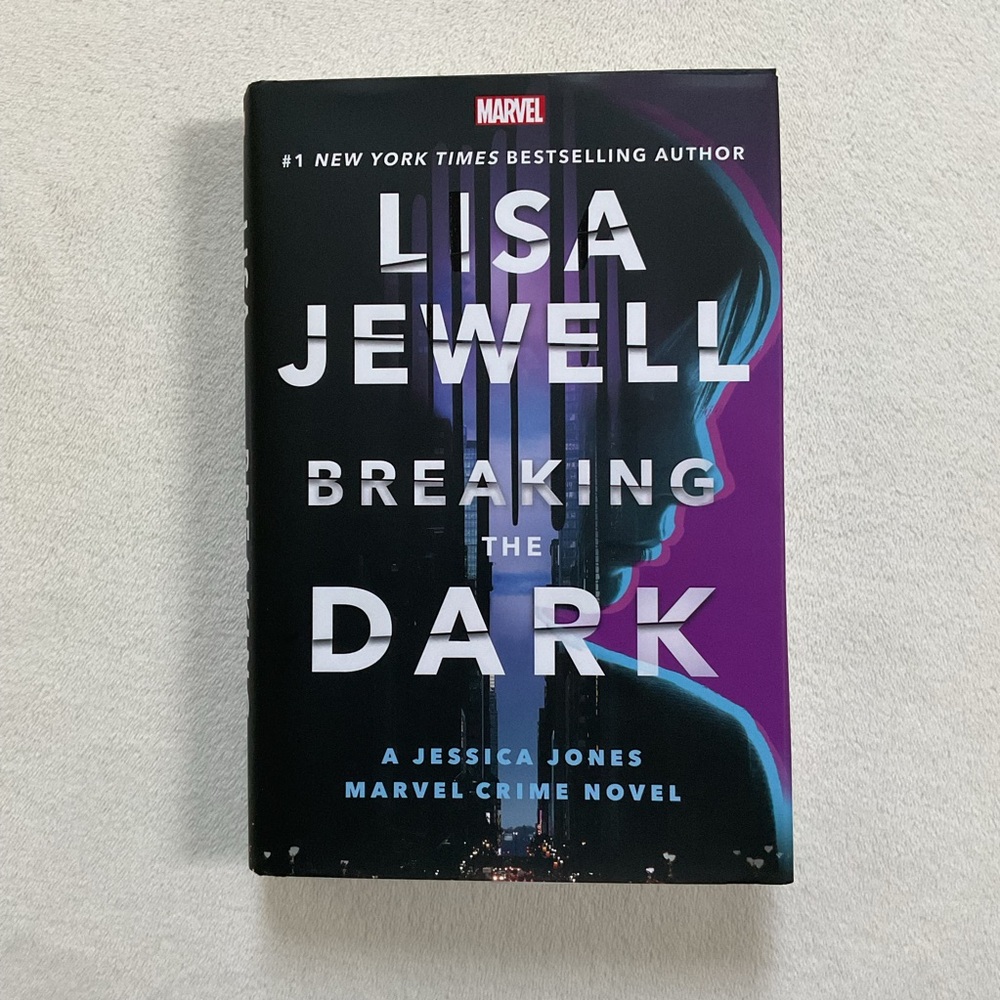 Lisa Jewell “Breaking the Dark” Hardcover – A Jessica Jones Marvel Crime Novel